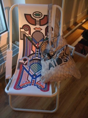 Folding chair and tribal print headphones.