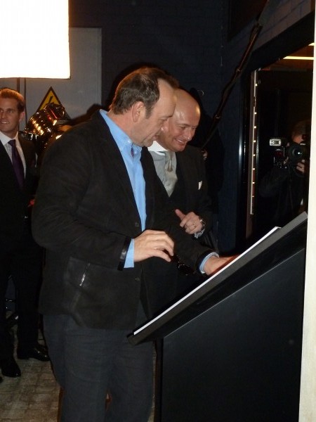 ...of Kevin Spacey and Georges Kern enjoying the photos.