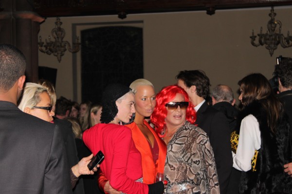 Model Amber Rose framed by other "ladies" in red